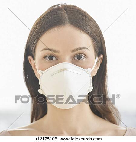Studio portrait of woman wearing flu mask View Large Photo Image Stock Photograph - Studio portrait of woman wearing flu mask. Fotosearch