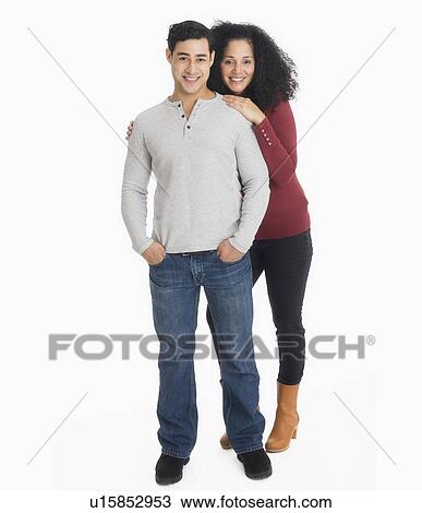 Studio portrait of young couple View Large Photo Image Stock Image - Studio portrait of young couple. Fotosearch