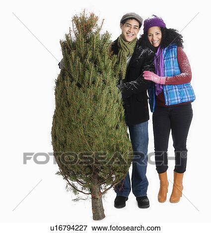 Studio portrait of young couple View Large Photo Image Stock Photo - Studio portrait of young couple. Fotosearch