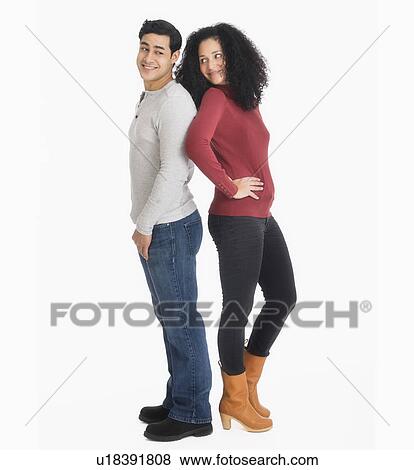 Studio portrait of young couple View Large Photo Image Stock Photo - Studio portrait of young couple. Fotosearch