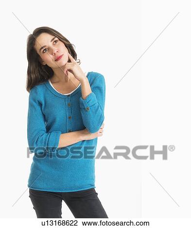 Stock Image - Studio shot of pensive young woman. Fotosearch