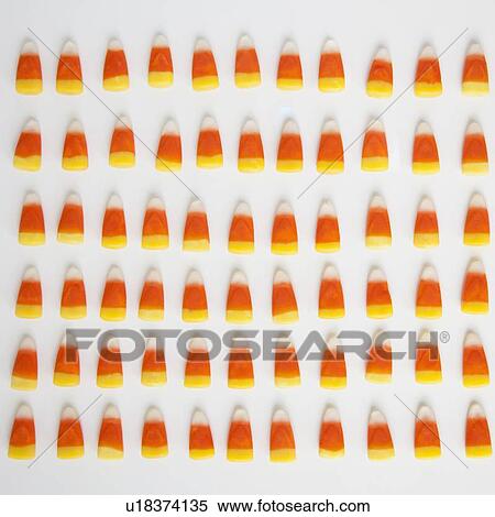 Stock Photography - Studio Shot of rows of candy corn. Fotosearch