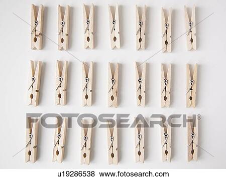 Stock Photo - Studio Shot of rows of clothespins. Fotosearch