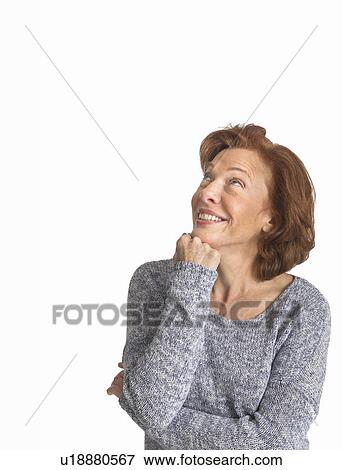 Studio shot of senior woman smiling View Large Photo Image Stock Photo - Studio shot of senior woman smiling. Fotosearch