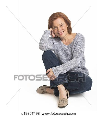 Stock Photo - Studio shot of senior woman smiling. Fotosearch