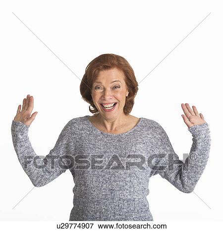 Studio shot of senior woman smiling View Large Photo Image Stock Photo - Studio shot of senior woman smiling. Fotosearch