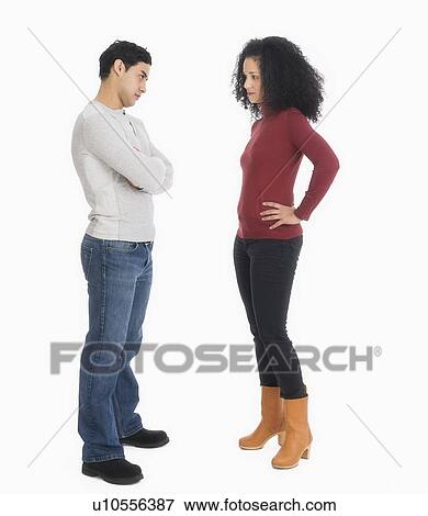 Stock Photo - Studio shot of young couple arguing. Fotosearch