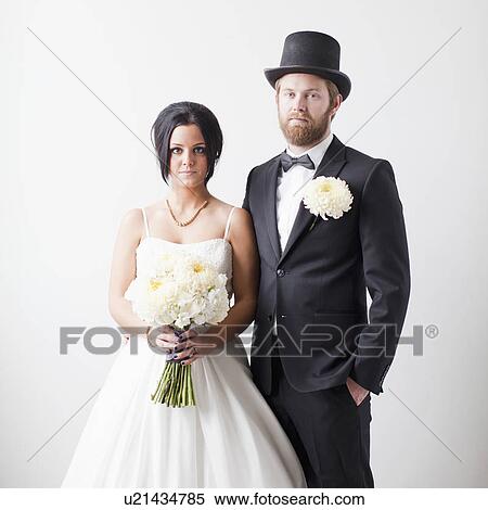 Stock Photography - Studio Shot portrait of bride and groom. Fotosearch