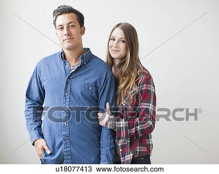 Studio Shot portrait of young couple View Large Photo Image Stock Image - Studio Shot portrait of young couple. Fotosearch