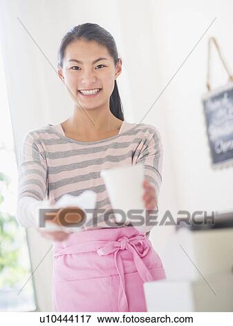 Teenage girl handing order View Large Photo Image Stock Photo - Teenage girl handing order. Fotosearch