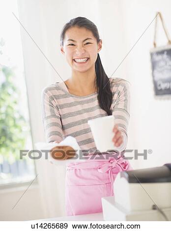 Teenage girl handing order View Large Photo Image Stock Photo - Teenage girl handing order. Fotosearch