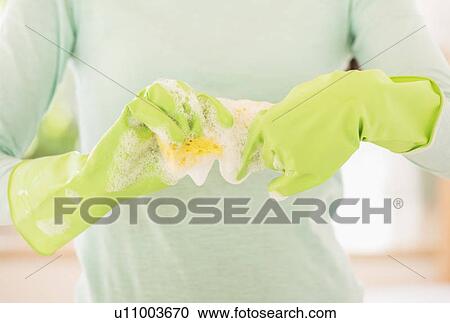Teenage girl wearing rubber gloves with washing sponge View Large Photo Image Stock Image - Teenage girl wearing rubber gloves with washing sponge. Fotosearch