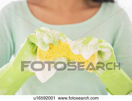 Teenage girl wearing rubber gloves with washing sponge View Large Photo Image Stock Image - Teenage girl wearing rubber gloves with washing sponge. Fotosearch