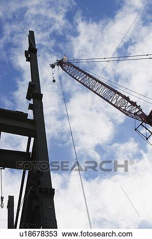 Upward view of crane and construction View Large Photo Image Stock Image - Upward view of crane and construction. Fotosearch