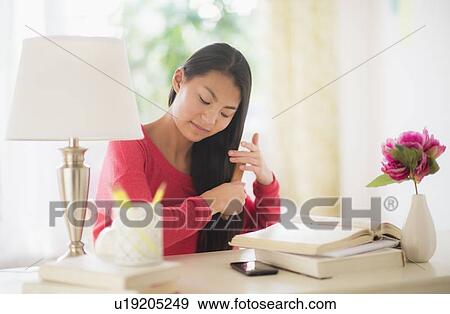 View of teenage girl ( 16-17 years) brushing hair View Large Photo Image Stock Photo - View of teenage girl ( 16-17 years) brushing hair. Fotosearch