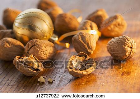 Stock Image - Walnuts and christmas decoration. Fotosearch