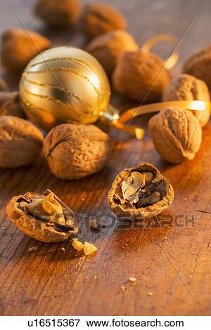 Walnuts and christmas decoration View Large Photo Image Stock Photo - Walnuts and christmas decoration. Fotosearch