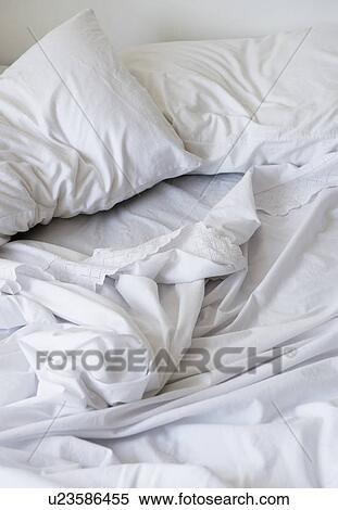 Stock Photography - White bedclothing in mess. Fotosearch