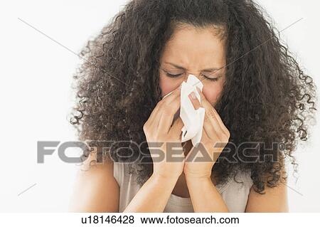 Stock Photo - Woman blowing nose. Fotosearch
