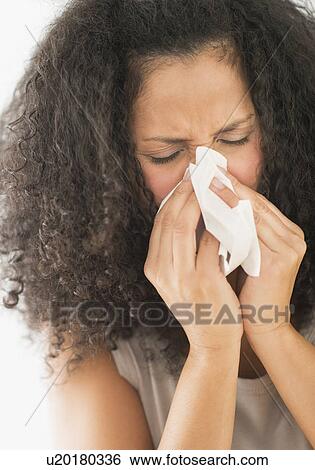 Woman blowing nose View Large Photo Image Stock Photograph - Woman blowing nose. Fotosearch