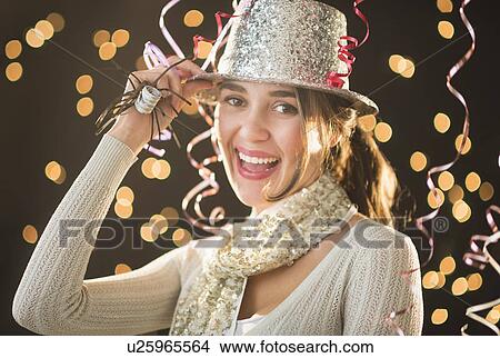Woman celebrating New Year's Eve View Large Photo Image Picture - Woman celebrating New Year's Eve. Fotosearch