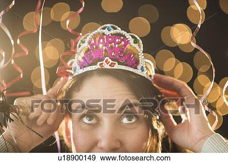 Stock Photo - Woman celebrating New Year's Eve. Fotosearch