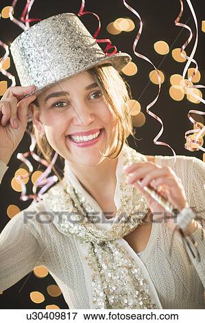 Woman celebrating New Year's Eve View Large Photo Image Stock Photo - Woman celebrating New Year's Eve. Fotosearch