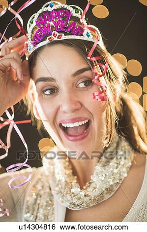 Woman celebrating New Year's Eve View Large Photo Image Stock Photograph - Woman celebrating New Year's Eve. Fotosearch
