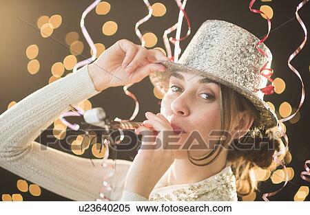 Woman celebrating New Year's Eve View Large Photo Image Stock Photography - Woman celebrating New Year's Eve. Fotosearch
