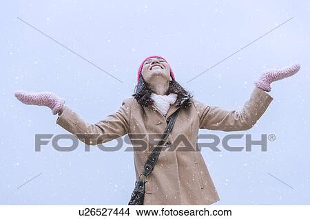 Woman in snowfall View Large Photo Image Picture - Woman in snowfall. Fotosearch