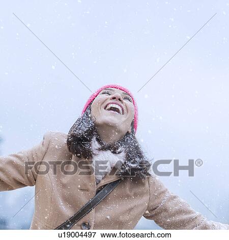 Woman in snowfall View Large Photo Image Stock Photo - Woman in snowfall. Fotosearch