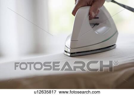 Stock Photo - Woman ironing. Fotosearch