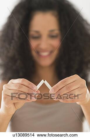 Woman quitting smoking View Large Photo Image Picture - Woman quitting smoking. Fotosearch