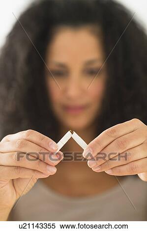 Stock Photography - Woman quitting smoking. Fotosearch