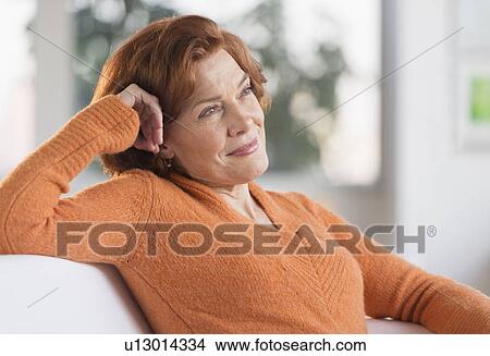 Woman relaxing at home View Large Photo Image Picture - Woman relaxing at home. Fotosearch