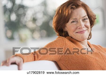 Woman relaxing at home View Large Photo Image Stock Photo - Woman relaxing at home. Fotosearch