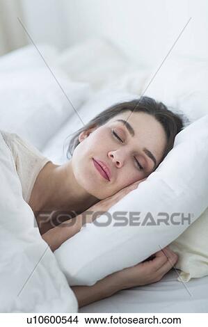 Woman sleeping in bed View Large Photo Image Picture - Woman sleeping in bed. Fotosearch
