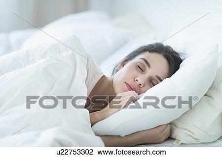 Woman sleeping in bed View Large Photo Image Stock Image - Woman sleeping in bed. Fotosearch