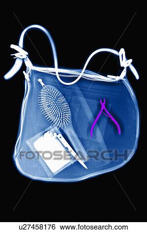 Stock Photograph - X-ray image of woman's shoulder bag. Fotosearch