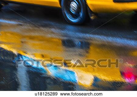 Stock Photo - Yellow cab in blurred motion. Fotosearch