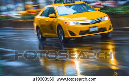 Yellow cab in blurred motion View Large Photo Image Stock Photo - Yellow cab in blurred motion. Fotosearch
