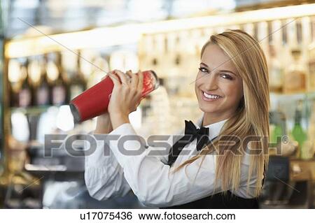 Young female bartender using cocktail shaker View Large Photo Image Stock Photograph - Young female bartender using cocktail shaker. Fotosearch