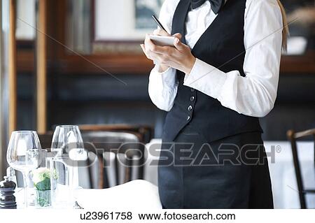 Young waitress taking order View Large Photo Image Stock Photo - Young waitress taking order. Fotosearch