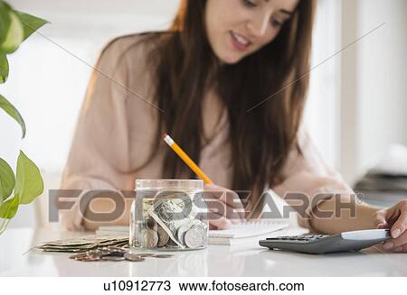 Young woman counting bills View Large Photo Image Stock Image - Young woman counting bills. Fotosearch