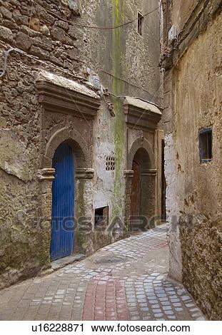 Arched doors in village alleyway View Large Photo Image Stock Image - Arched doors in village alleyway. Fotosearch