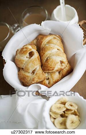 Stock Photo - Baked pastries with banana. Fotosearch