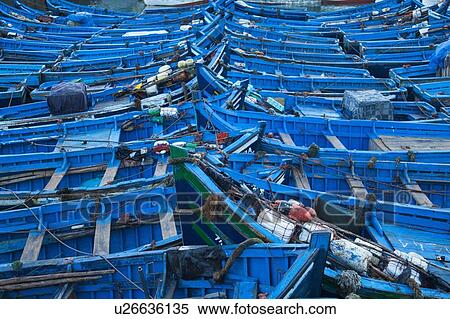 Stock Photography - Blue boats docked in harbor. Fotosearch