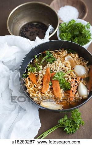 Stock Photo - Bowl of vegetable noodle soup. Fotosearch