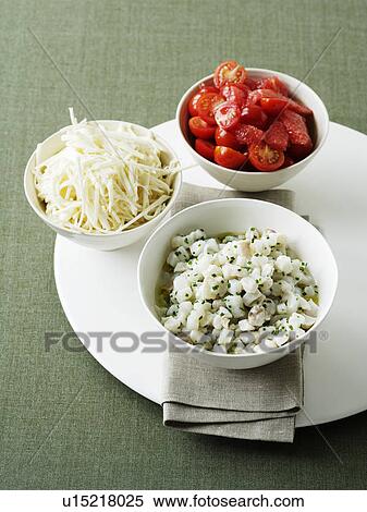 Bowls of cheese and tomatoes View Large Photo Image Stock Photography - Bowls of cheese and tomatoes. Fotosearch