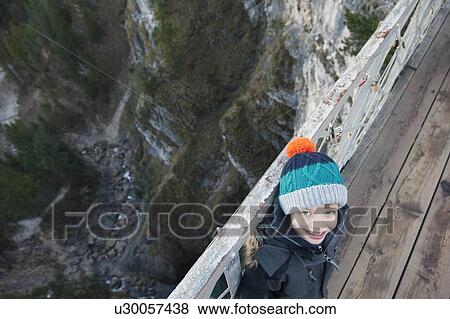 Boy standing on wooden pier View Large Photo Image Stock Photo - Boy standing on wooden pier. Fotosearch